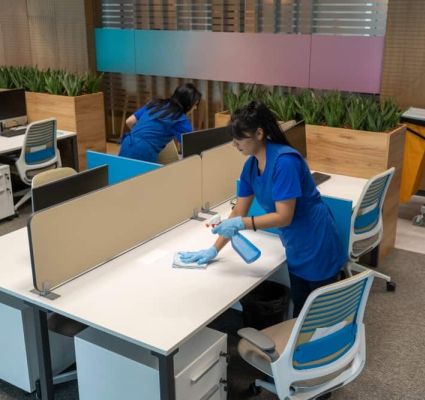 cleaning desks in an empty office